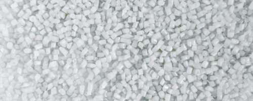 Polypropylene granule close-up background texture. plastic resin ( Masterbatch).Grey chemical granules for industrial plastic production